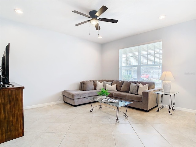 living room featuring ceiling fan and light tile patterned floors