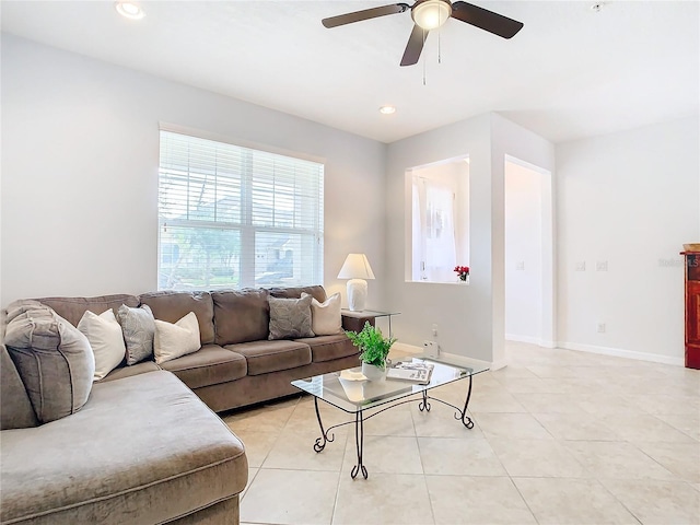 tiled living room with ceiling fan