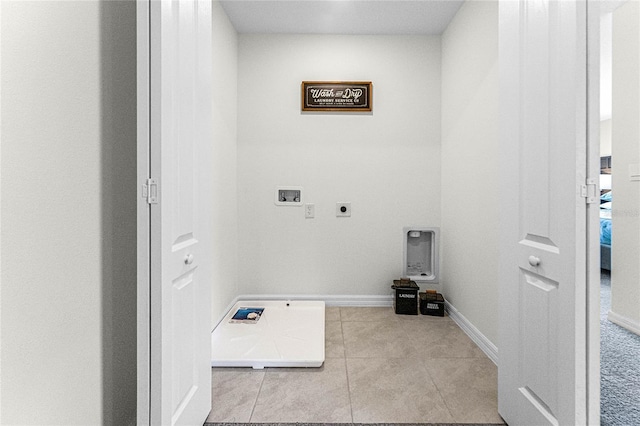 washroom featuring electric dryer hookup, light tile patterned floors, and washer hookup