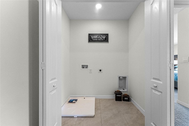 clothes washing area with electric dryer hookup, light tile patterned floors, and hookup for a washing machine