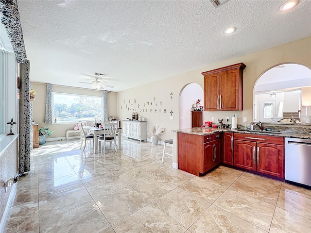 kitchen with dishwasher, a textured ceiling, ceiling fan, and sink