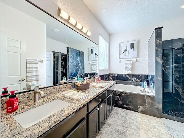 944 Torrey Pine Dr, Winter Springs, FL 32708 - bathroom with a garden tub, a marble finish shower, double vanity, a textured wall, and a textured ceiling