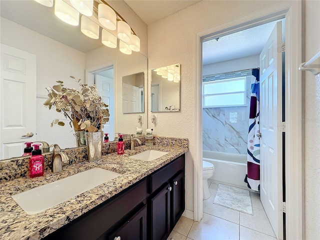 full bathroom featuring tile patterned flooring, shower / bath combo, toilet, and vanity