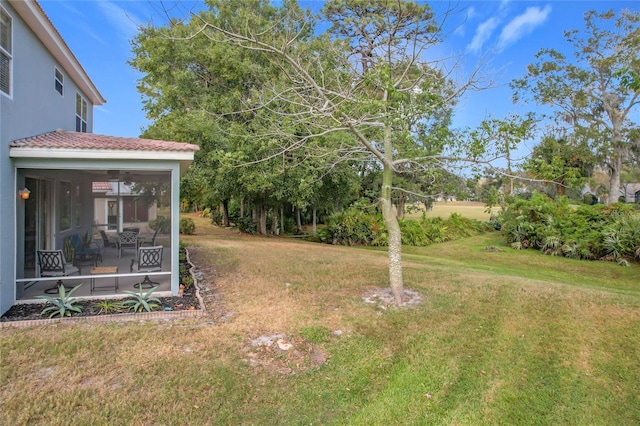 view of yard with a sunroom