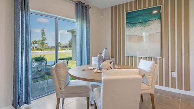 dining space with light tile patterned floors