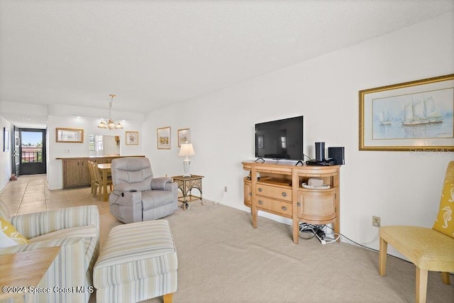 living room featuring light colored carpet and an inviting chandelier