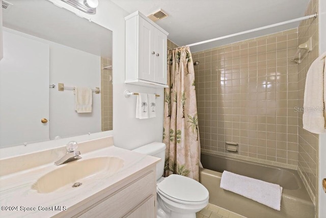 full bathroom with tile patterned floors, vanity, toilet, and shower / tub combo with curtain