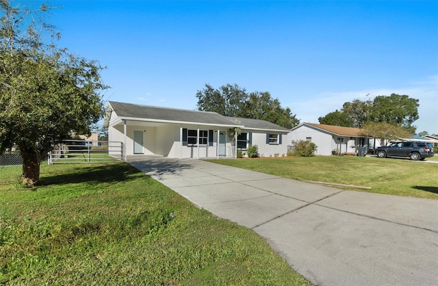 single story home with a front lawn and a carport