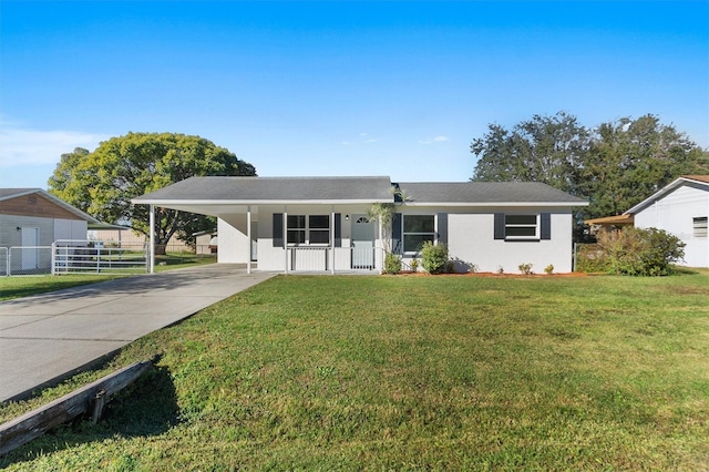 ranch-style home with a carport, covered porch, and a front lawn