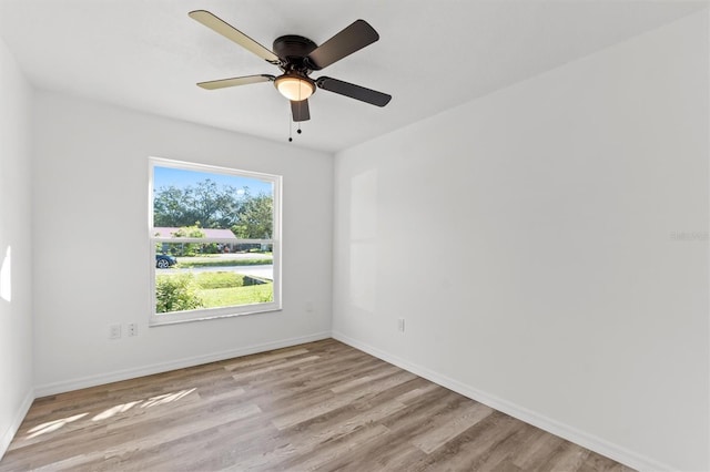 unfurnished room with ceiling fan and light wood-type flooring