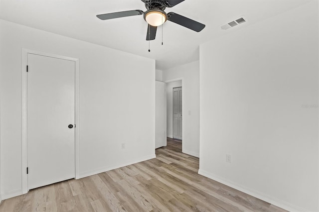 unfurnished bedroom with ceiling fan and light wood-type flooring