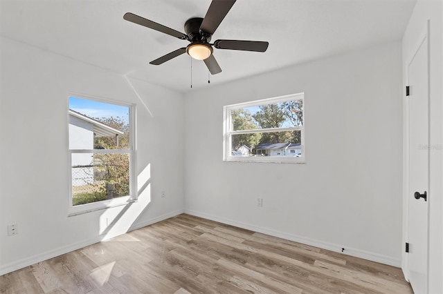 unfurnished room with light hardwood / wood-style flooring and ceiling fan