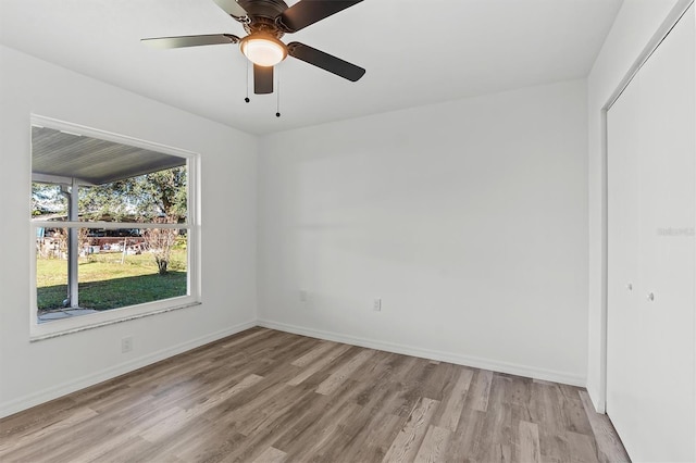 spare room with ceiling fan and light hardwood / wood-style floors