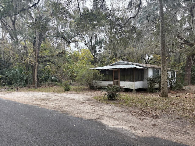 view of front of property with a sunroom