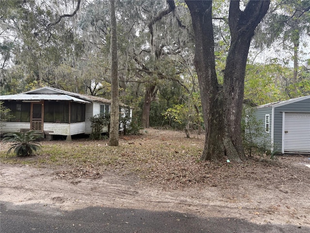 view of yard with a sunroom