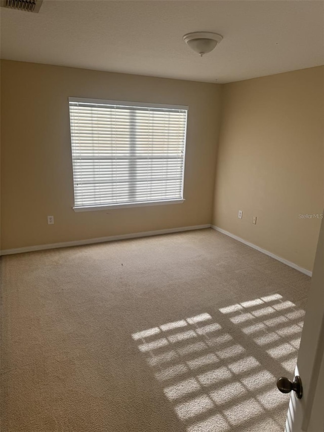 unfurnished room with carpet