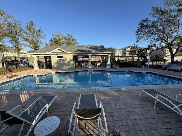 view of swimming pool featuring a patio area