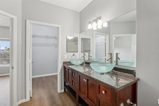 bathroom with vanity and hardwood / wood-style flooring