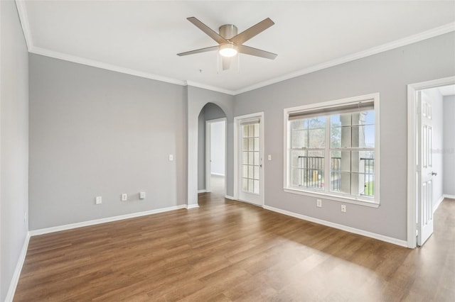 spare room with ceiling fan, ornamental molding, and hardwood / wood-style flooring