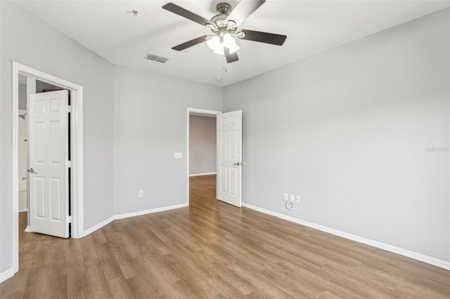 unfurnished bedroom with ceiling fan and light hardwood / wood-style floors