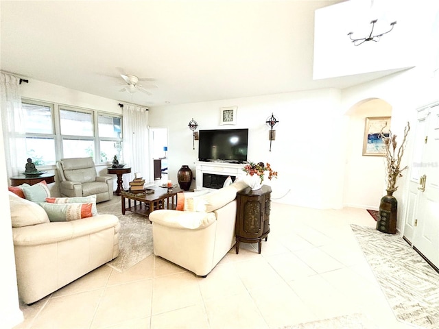 living room featuring ceiling fan and light tile patterned flooring