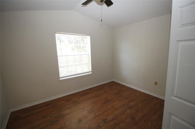 unfurnished room featuring ceiling fan, dark hardwood / wood-style flooring, and vaulted ceiling