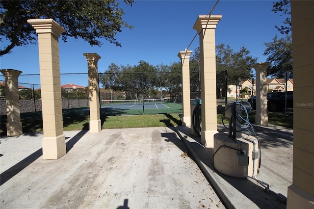 view of patio / terrace featuring tennis court