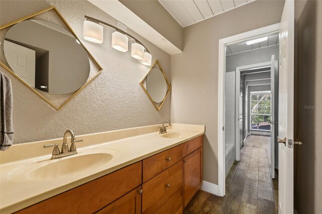 bathroom with hardwood / wood-style flooring and vanity