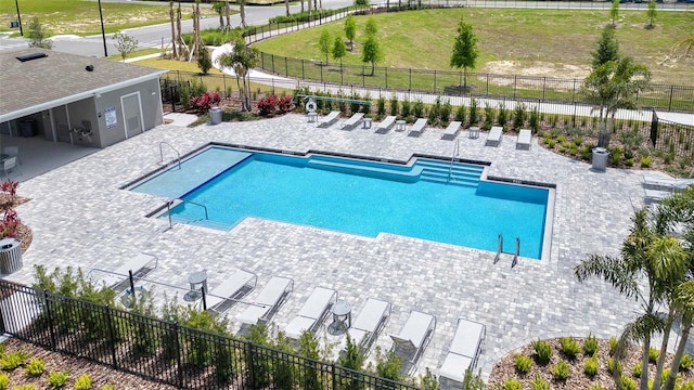 view of swimming pool with a patio