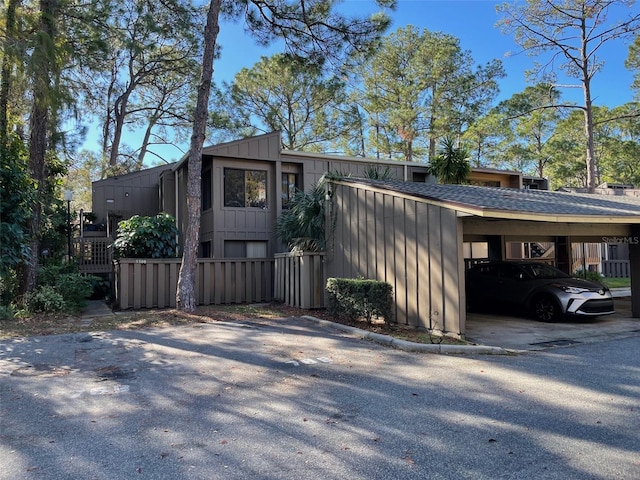 5308 Pebble Beach Dr Unit F-01-1, Orlando, FL 32811 - view of property exterior featuring board and batten siding