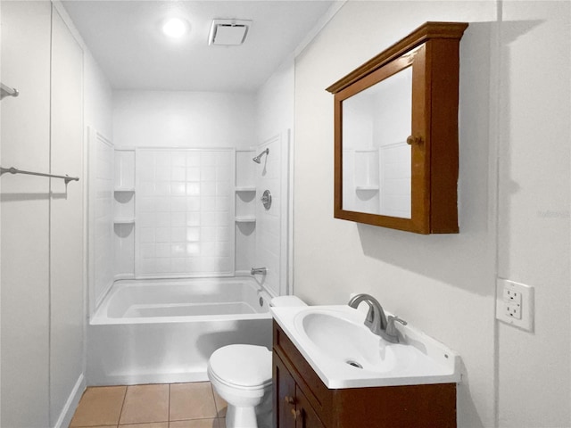 full bathroom with vanity, tiled shower / bath combo, tile patterned floors, and toilet