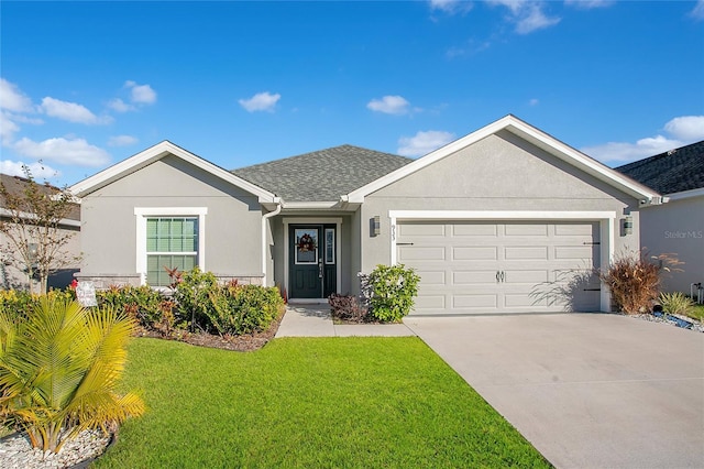 single story home with a garage and a front lawn