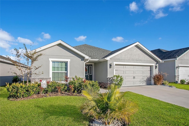 single story home with a garage and a front lawn