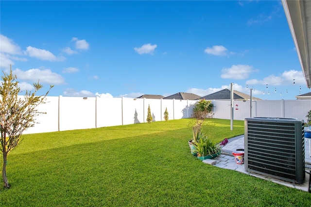 view of yard featuring central AC unit