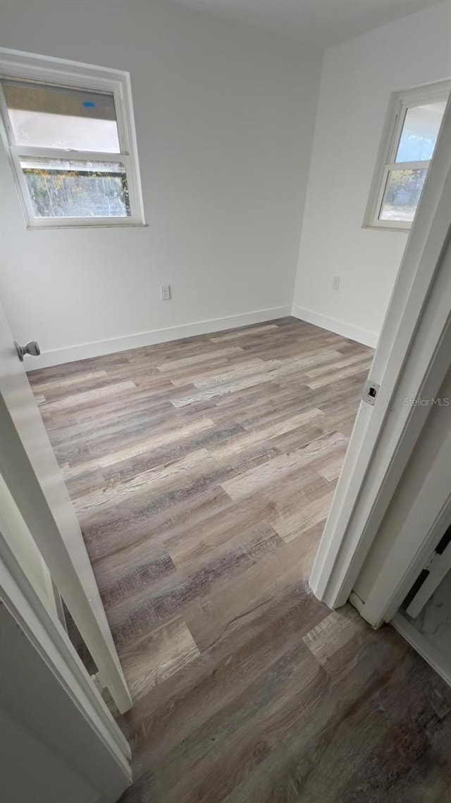 unfurnished room with light hardwood / wood-style floors