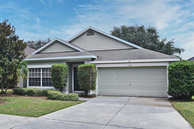 ranch-style house featuring a garage