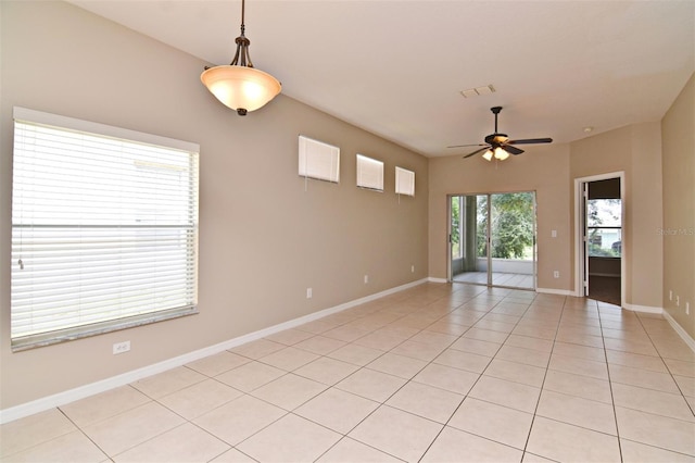 tiled empty room with ceiling fan