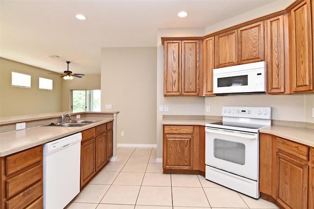 kitchen with ceiling fan, white appliances, sink, and light tile patterned floors