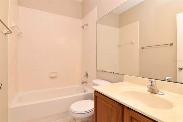 full bathroom with vanity, tiled shower / bath, and toilet