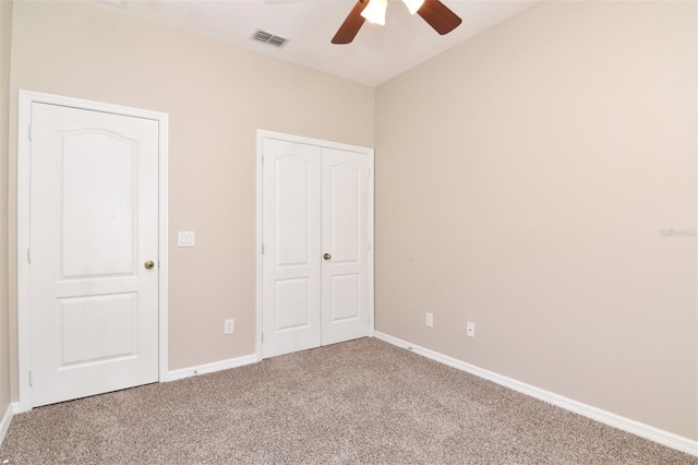 unfurnished bedroom with carpet flooring and ceiling fan