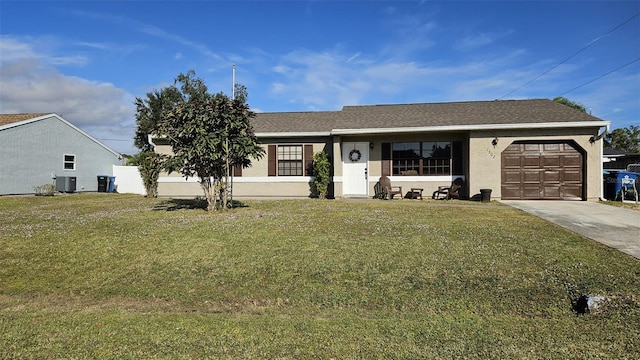 single story home featuring a garage, central air condition unit, and a front lawn