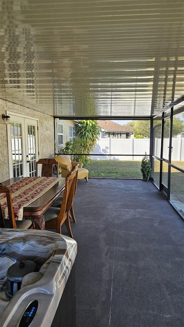 unfurnished sunroom featuring french doors and plenty of natural light