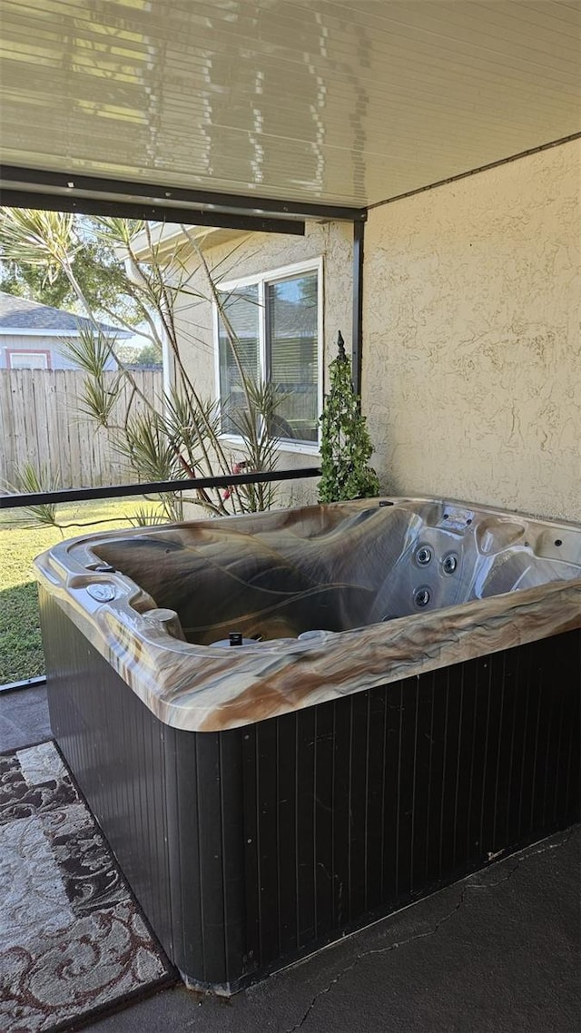 exterior space featuring a hot tub