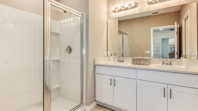 bathroom with vanity and walk in shower