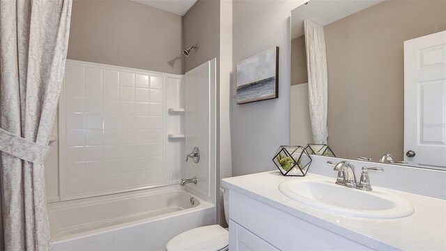 full bathroom featuring vanity, shower / bath combination with curtain, and toilet