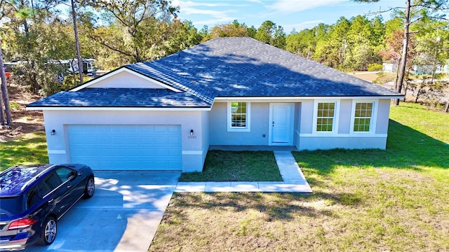 single story home with a garage and a front lawn