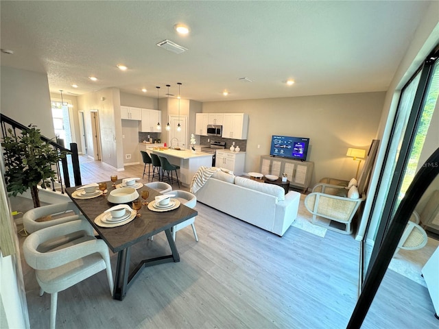 living room with light hardwood / wood-style floors