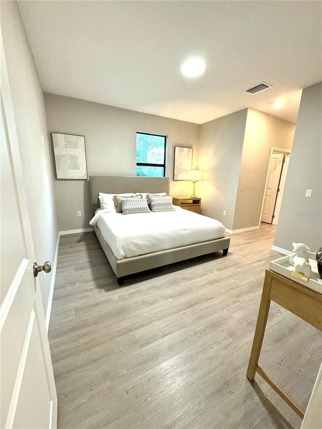 bedroom featuring light hardwood / wood-style floors