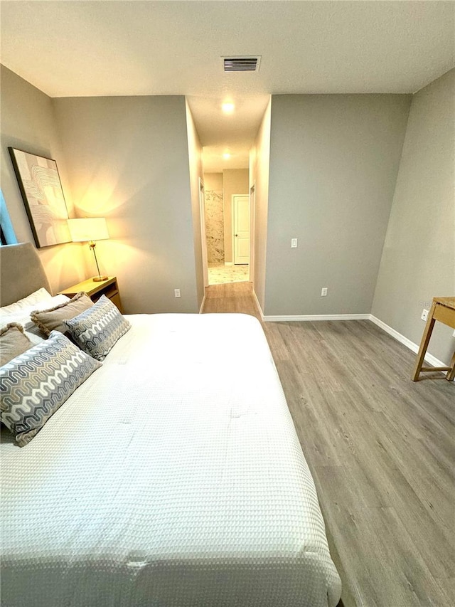 bedroom featuring light hardwood / wood-style flooring