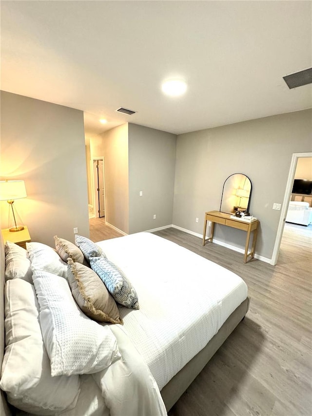 bedroom featuring hardwood / wood-style flooring